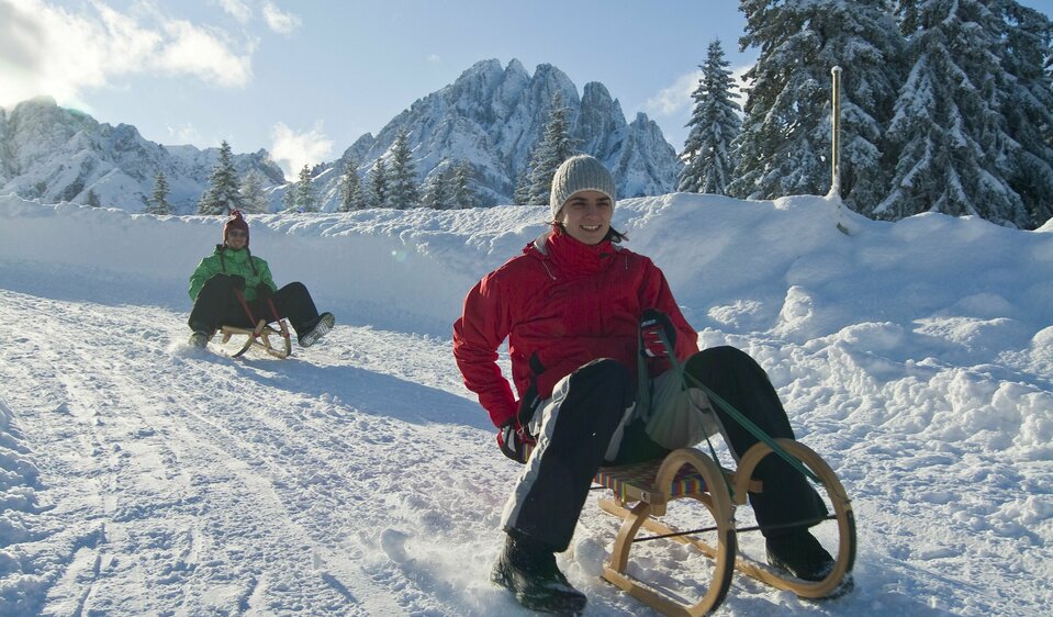 Tobogganing fun from the Dolomitenhütte down into the valley 